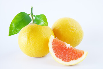 Fresh grapefruits with slices isolated on a white background