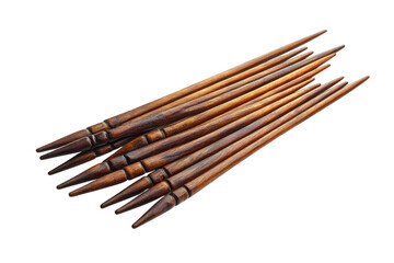 Set of wooden sticks arranged neatly on a white background showcasing craftsmanship and natural materials