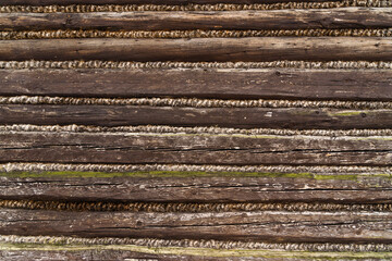 Log structure - Historic house wall as background.