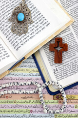Bible, Quran and Torah with symbols of religions. Concept of interfaith dialogue.