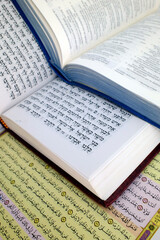 Obraz premium Quran, Bible, Talmud or Torah. Most significant religious texts revered by Judaism, Islam, and Christianity. Christianity, Islam and Judaism. Religious symbols. Faith and spirituality concept.