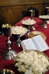 Protestant church. Bible, vine and bread on altar. Communion in memory of the Last Supper instituted by Christ before his death. Paris. France.