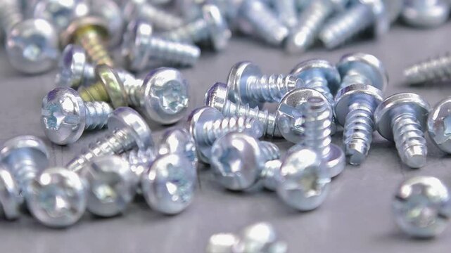 Metal screws for fastening equipment. Soft focus. Close-up. 