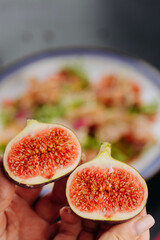 Close-up of fresh, ripe figs split in half showcasing their vibrant and juicy interior texture