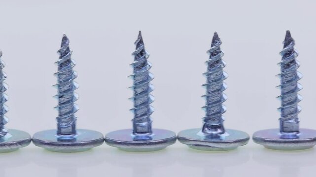 Metal screws for fastening equipment. Soft focus. Close-up. 