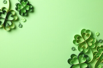 Happy St Patrick's Day concept. Flat lay composition with paper cut clover leaves and confetti on...