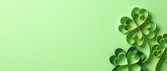 Happy St Patrick's Day banner template. Top view paper cut four leaf clover isolated on green...