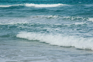 Ocean waves gently breaking on the shore