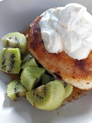kiwi with pancakes and whipped cream