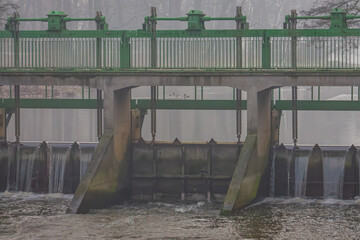 water dam on the river, regulating the water level in the water reservoir.