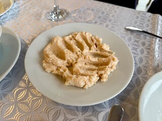 Raki appetizer Taramosalata Greek spread Paste (pate) made of ground fish, shrimps, and caviar, served with lemon. Fish Egg Paste Tarama