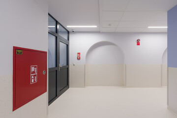 Modern Hallway with Arches, Fire Safety, and Minimalist Design