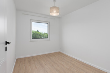 Empty Room with Window and Wooden Floor
