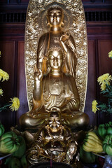 Phuoc Duyen buddhist pagoda. Main altar with golden Buddha statues.  Hue. Vietnam.