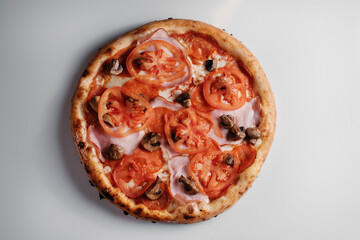 Italian pizza with tomatoes and mushrooms
