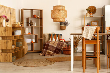 Obraz premium Interior of modern kitchen with wooden furniture and pumpkins