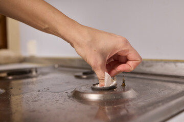 Cleaning a gas stove burner with careful precision is an essential part of kitchen maintenance