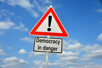 Burgdorf, Lower Saxony, Germany - January 16, 2024: Traffic warning sign saying Democracy in danger