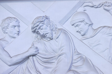 Fototapeta premium The Redeemer Church (or Notre Dame Cathedral). Way of the cross. 9th Station: Jesus falls a third time. Ho Chi Minh City. Vietnam.