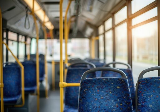 Rows of empty blue seats inside a public transport bus, illuminated by natural light during the daytime - Powered by Adobe