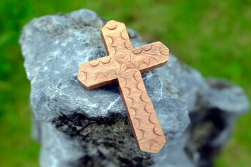 Close-up of a Christian cross on a rock. Symbol of eternity. .