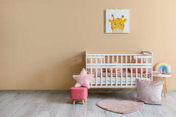 Interior of stylish baby room with comfortable crib