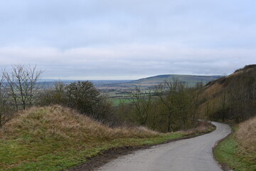 winding countryside road with beautiful surrounding English countryside