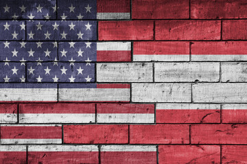 colourful painted big flag of united states of america and flag of austria on a massive old brick...