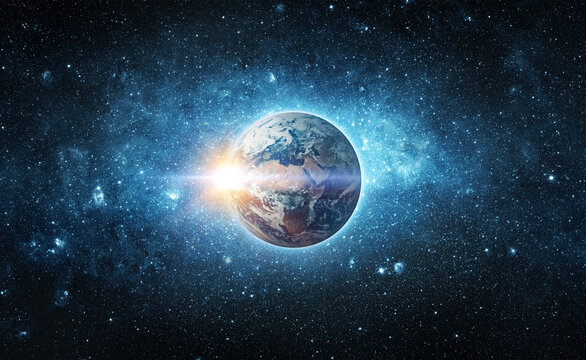 Panoramic view of the Earth, sun, star and galaxy. Sunrise over planet Earth, view from space. Concept on the theme of ecology, environment, Earth Day. Elements of this image furnished by NASA.