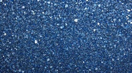 Obraz premium A dark blue glitter texture resembling a starry night sky, with tiny