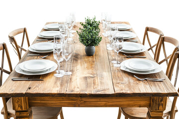 Elegant dining table set with plates, glasses, and cutlery arranged on a rustic wooden surface against a transparent background