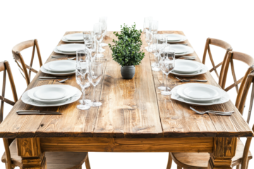 Elegant dining table set with plates, glasses, and cutlery arranged on a rustic wooden surface against a transparent background