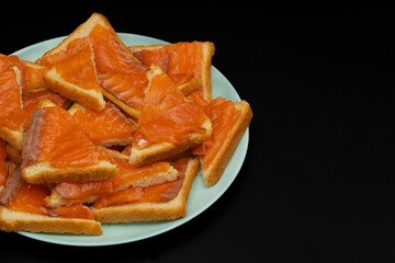 Sandwiches with salted salmon on a plate. Preparing for the holiday.