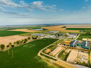 Countryside farming surrounded by planted fields with crops