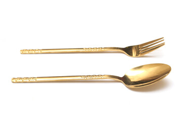 Perspective view of Golden Cutlery set isolated white background