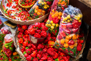 Peppers at a sales stand. Plant with a hot and spicy flavor. Fruit, seed or condiment.
