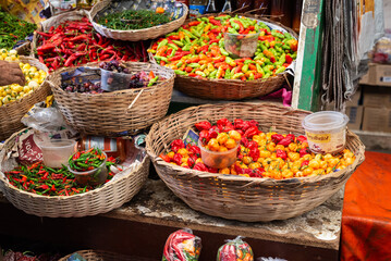 Peppers at a sales stand. Plant with a hot and spicy flavor. Fruit, seed or condiment.