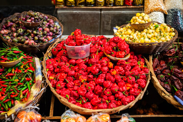 Peppers at a sales stand. Plant with a hot and spicy flavor. Fruit, seed or condiment.