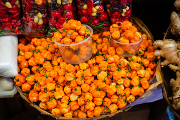Peppers at a sales stand. Plant with a hot and spicy flavor. Fruit, seed or condiment.