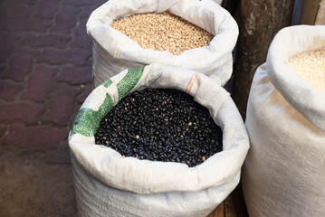 Beans for sale at a stand. Legume seed rich in nutrients such as proteins, fibers, vitamins, minerals and essential amino acids.