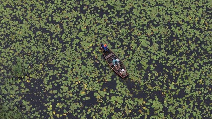 Fishermen in a Boat on a Calm Lake