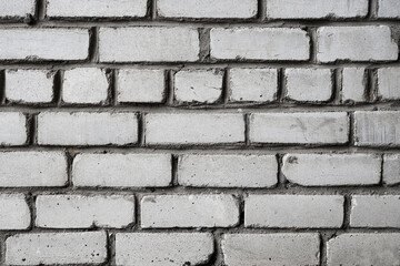 Texture of grey brick wall as background, closeup