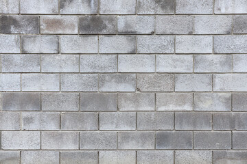 Texture of grey brick wall as background, closeup