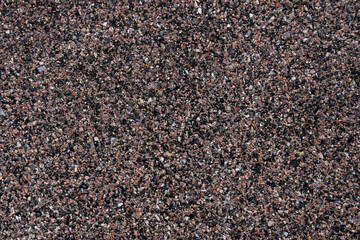 Texture of pebbles on sea beach, top view