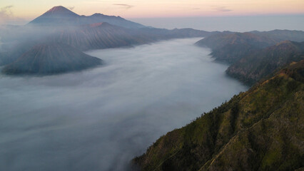 Fog creating a mystic scenery at sunrise, seen from above