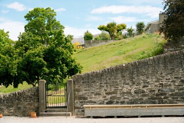 Ancient Stone Wall Overlooking an Enchanting Meadow