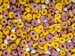 Close-up of colorful cereal loops with marshmallows. Perfect for breakfast, fun, and playful food themes