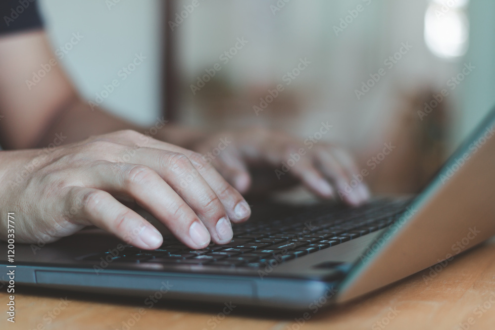 Poster Man using laptop computer at the home office. hand typing on keyboard, searching information, browsing on internet. IT administrator remote job support. Freelancer working and editing something.