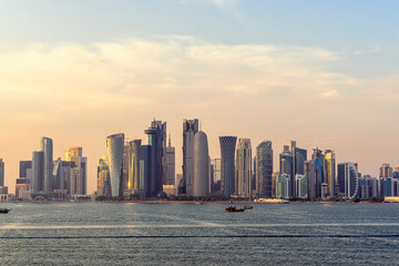 doha qatar skyscrapers by the sea at sunset