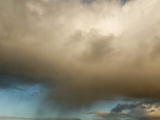 Obraz premium Rainy cloud with rainbow. Nature abstract background.